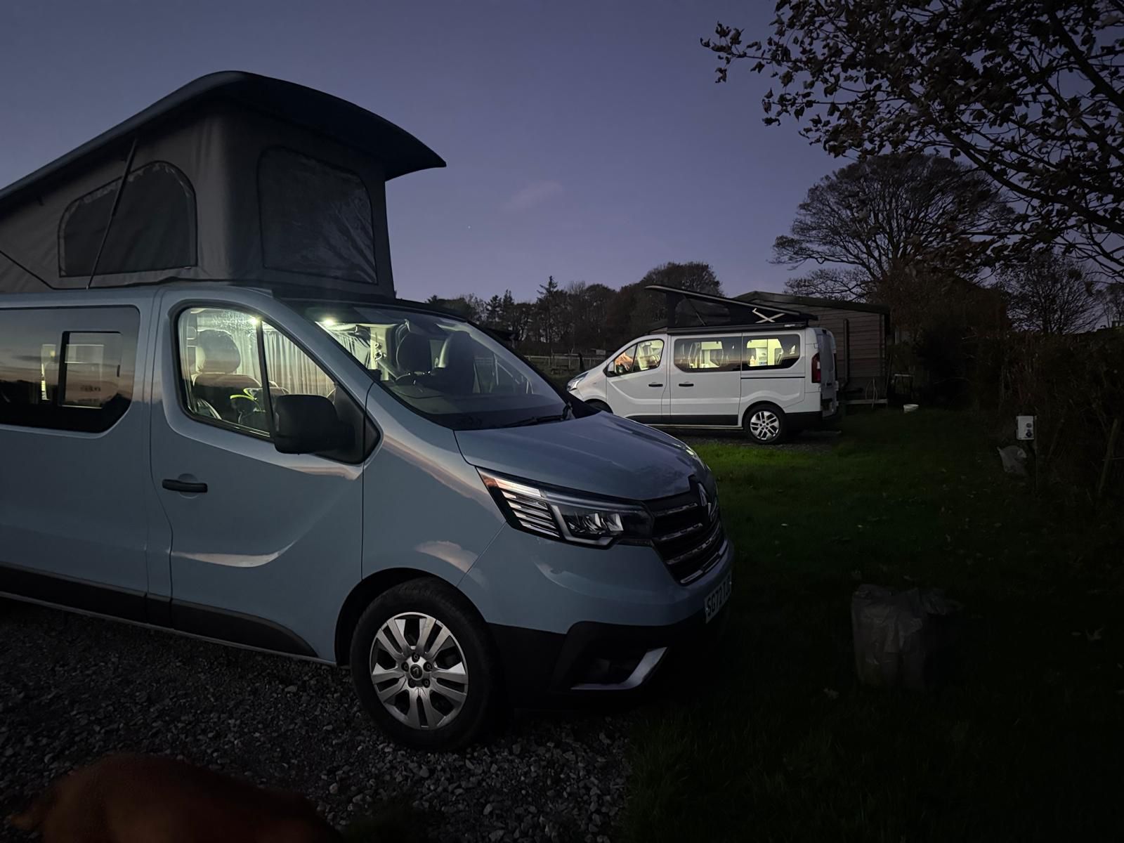 Lulu and Maisie-Moo campervans together at dusk