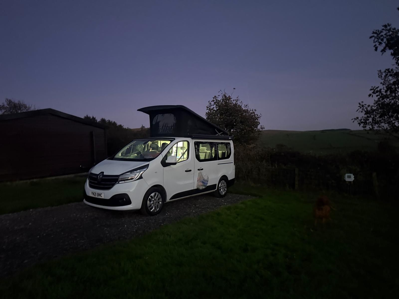 Lulu campervan with pop-top roof at dusk