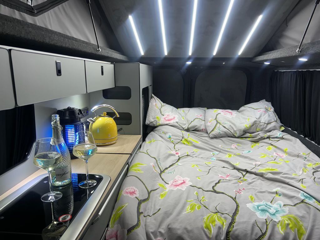 Lulu campervan pop-top bed with floral bedding