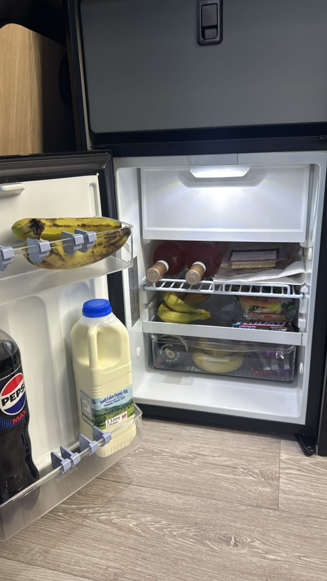 Stocked campervan fridge ready for a trip