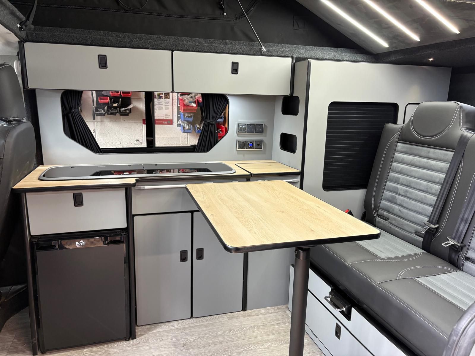 Lulu campervan kitchen with fold-out dining table